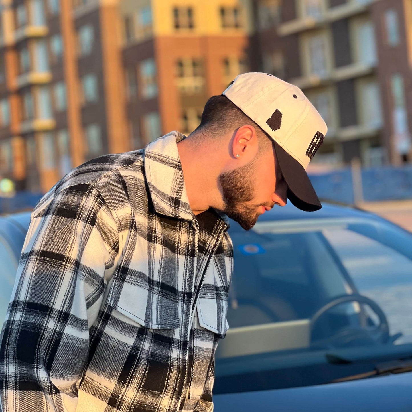 Model Wearing Georgia Off White Snapback – Close-Up Angled View