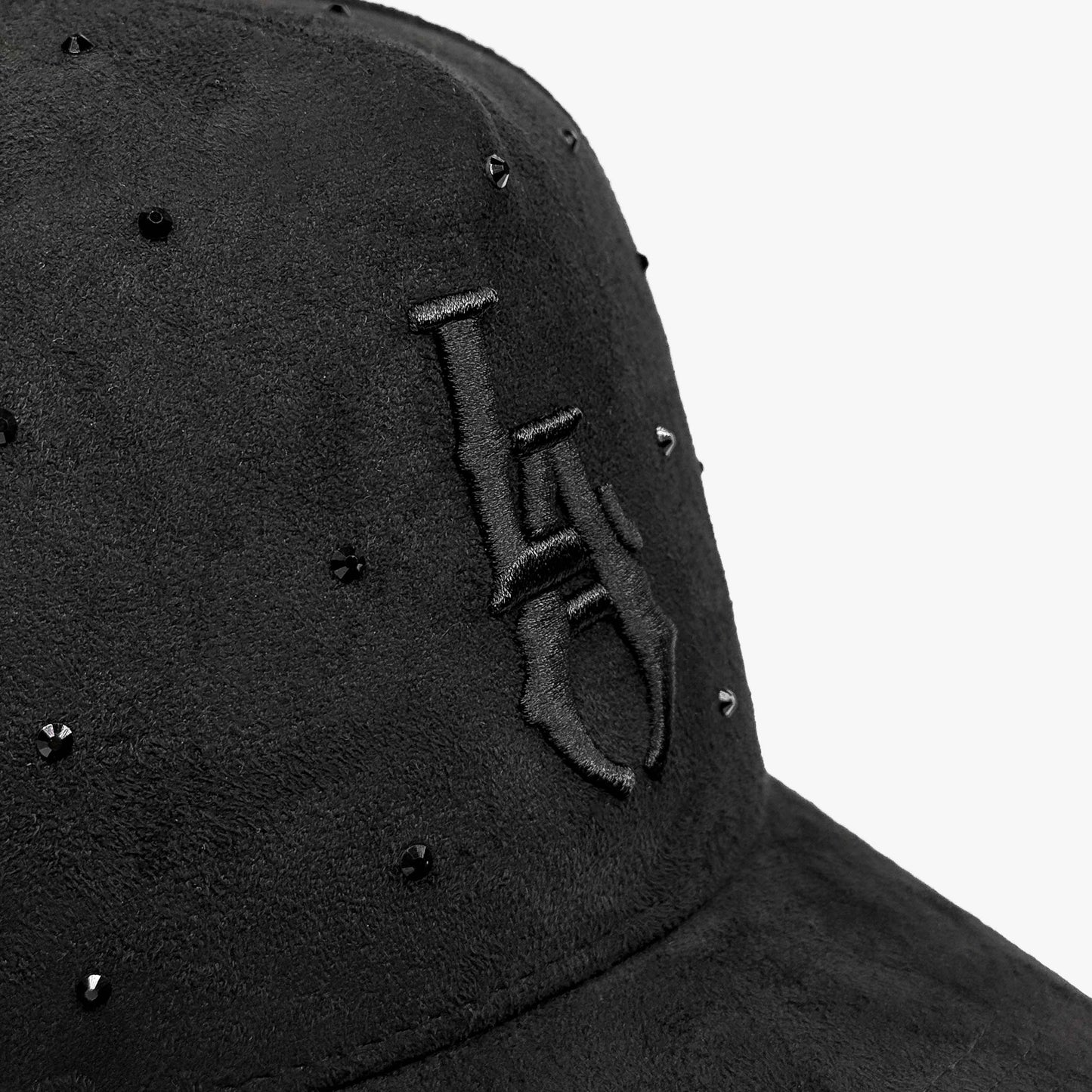 Close-up of LA Starlight Smoke Edition hat showing intricate black-on-black embroidery and crystal accents