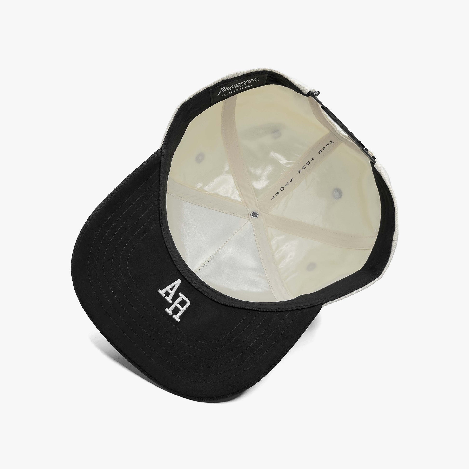 Arkansas Off White 5-Panel Snapback Hat – Under Brim View with AR Abbreviation Embroidery