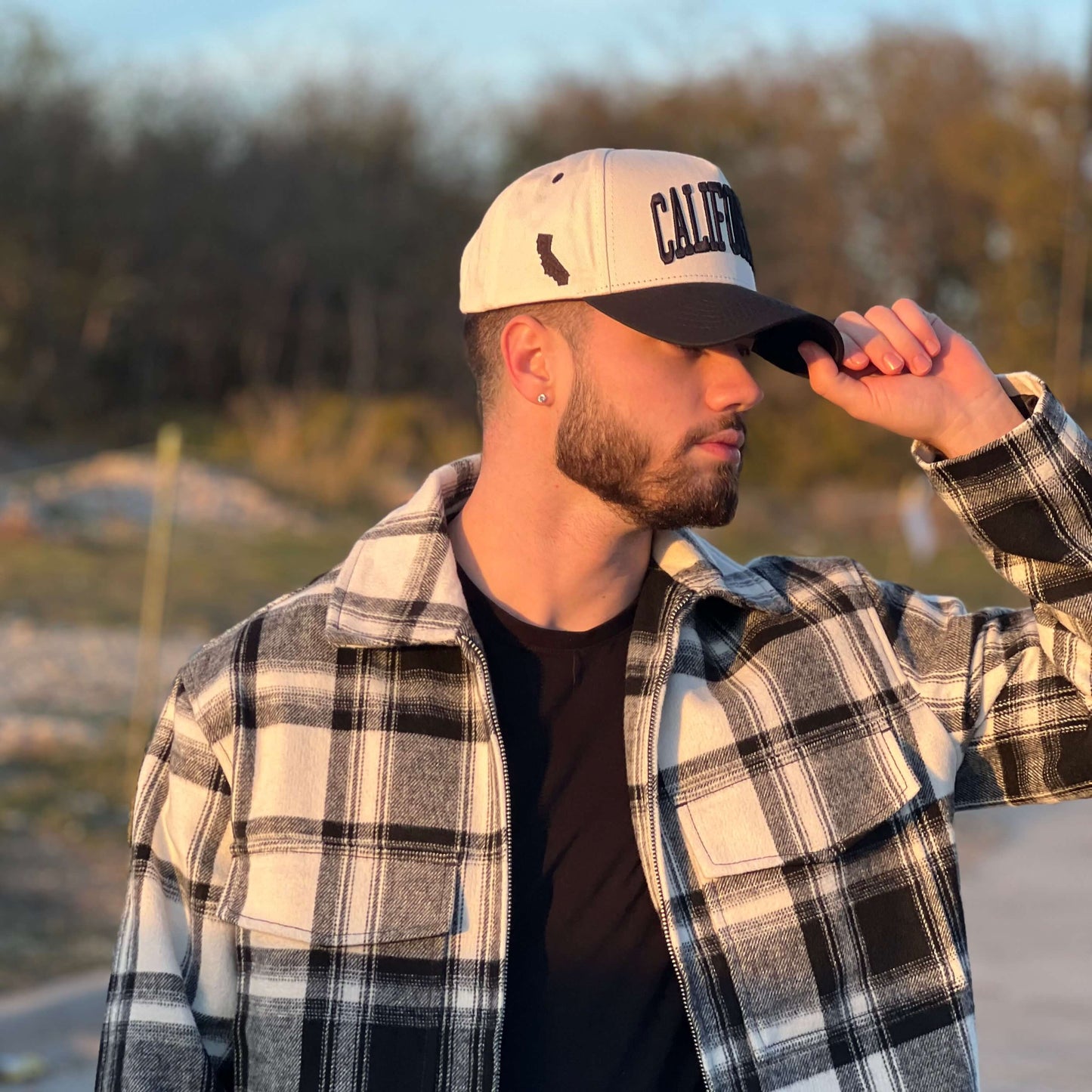 Model Wearing California Off White Snapback – Side Profile Outdoors