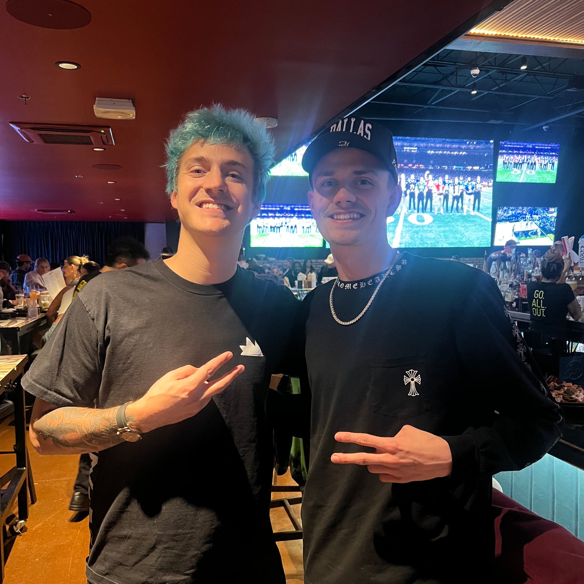 Group wearing Dallas Black Snapback Hat at bar event
