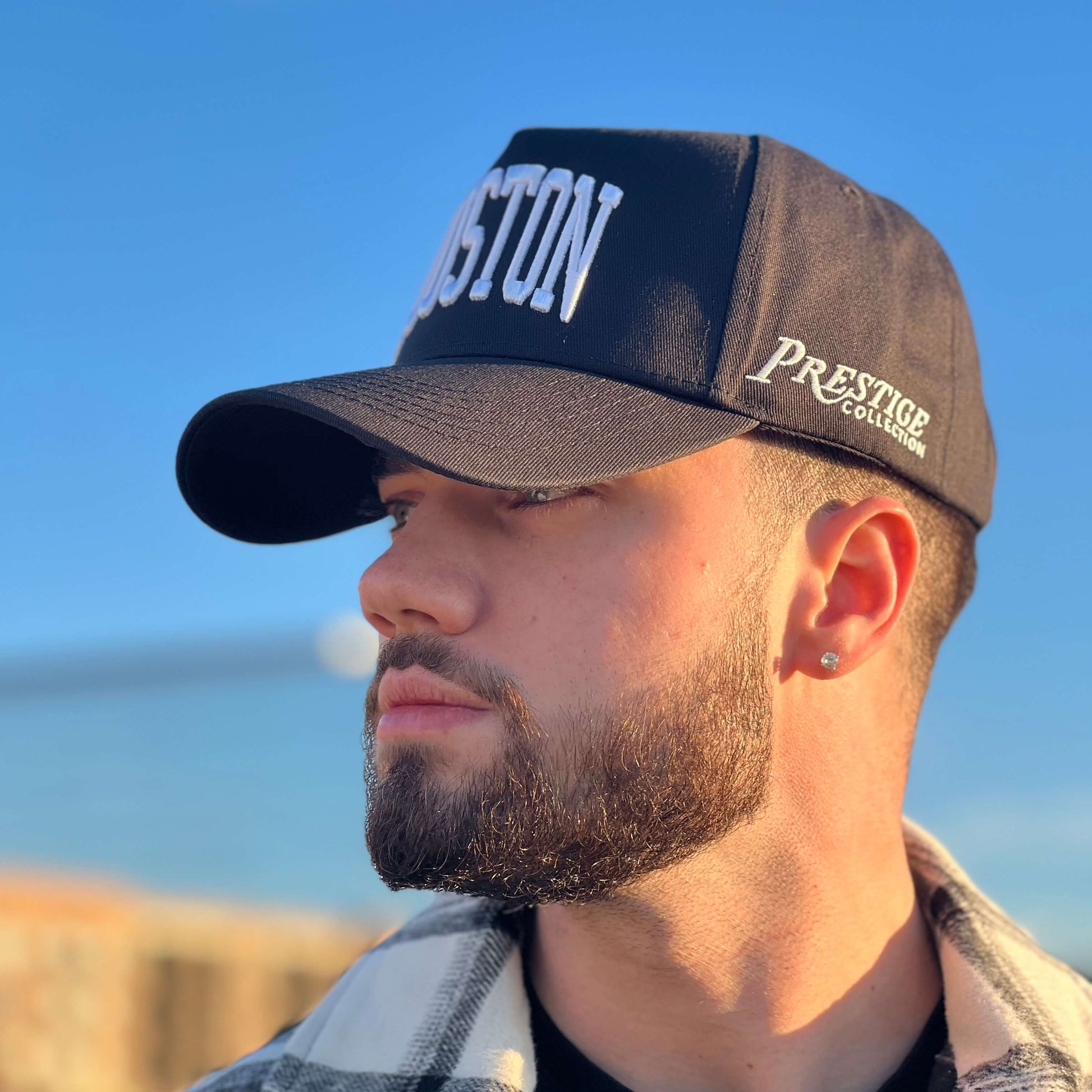 Model wearing Houston Black Snapback Hat outdoors