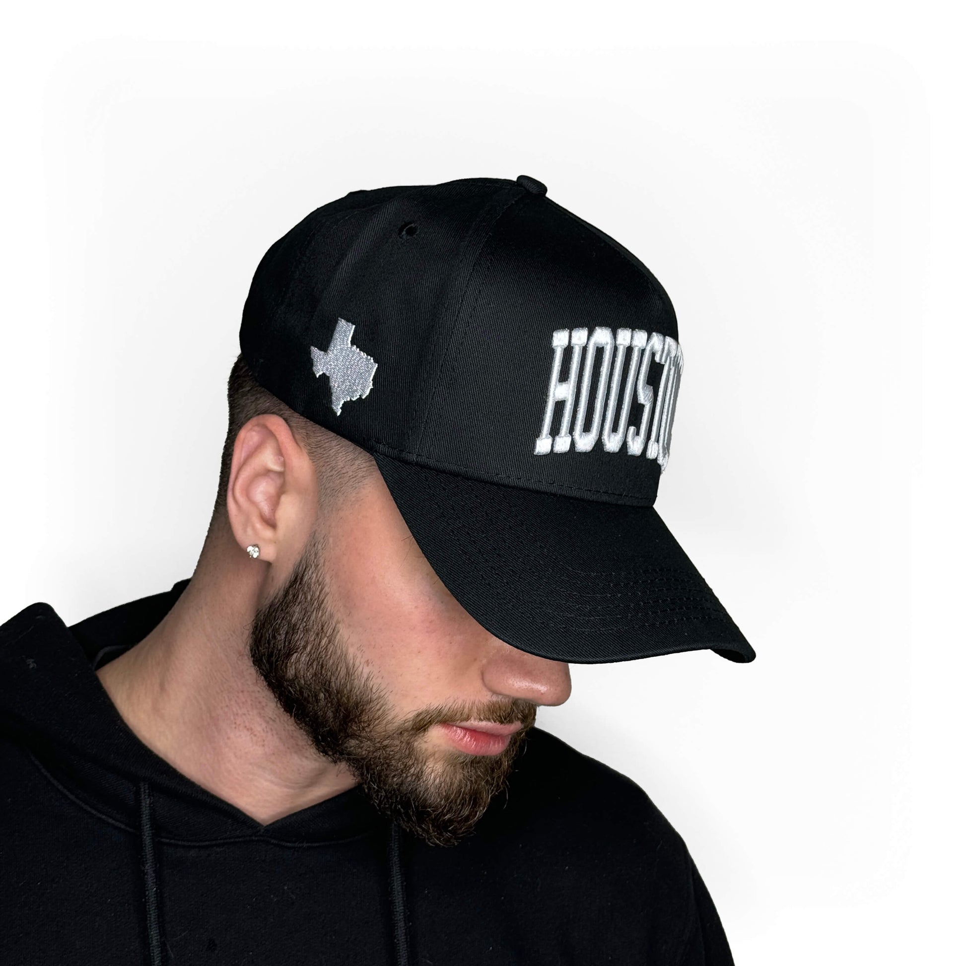 Model wearing Houston Black Snapback Hat – Side Profile View
