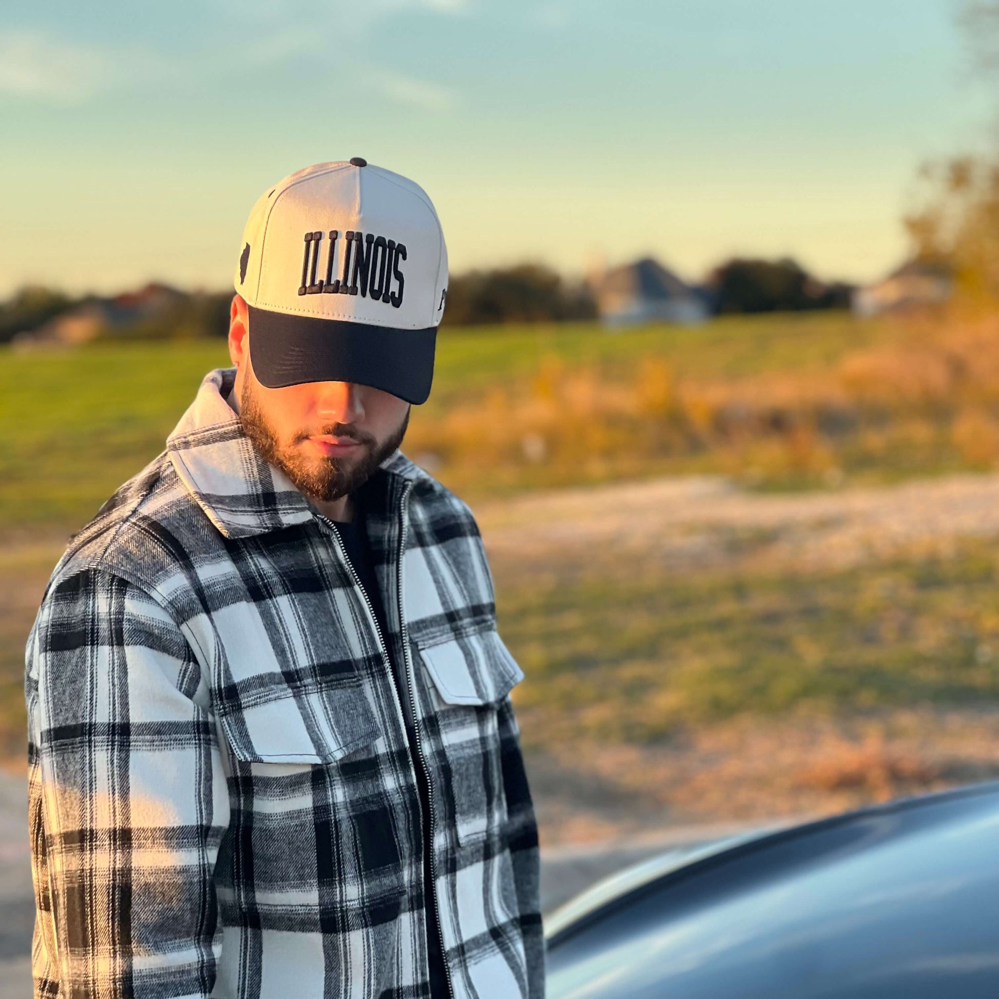 Model Wearing Illinois Off White Snapback – Outdoor Front Profile in Flannel Shirt