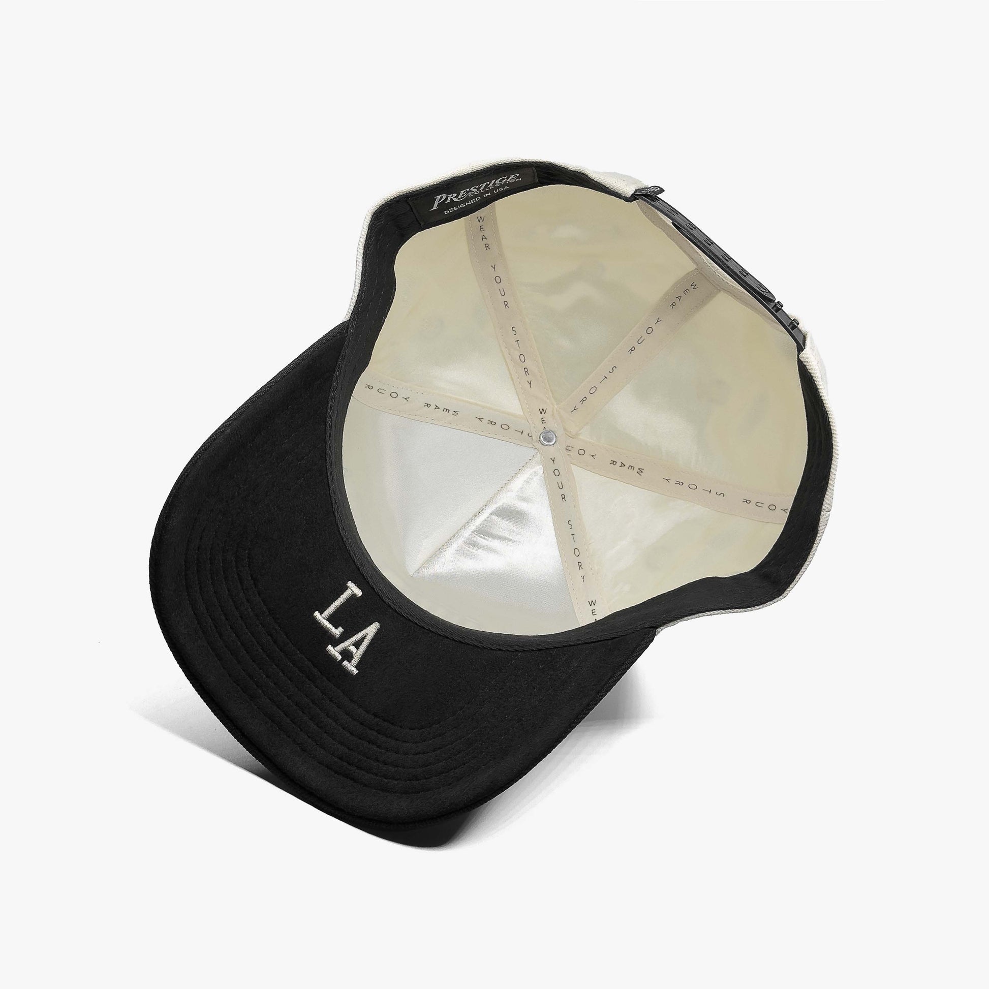 Louisiana Off White 5-Panel Snapback Hat – Under Brim View with LA Abbreviation Embroidery
