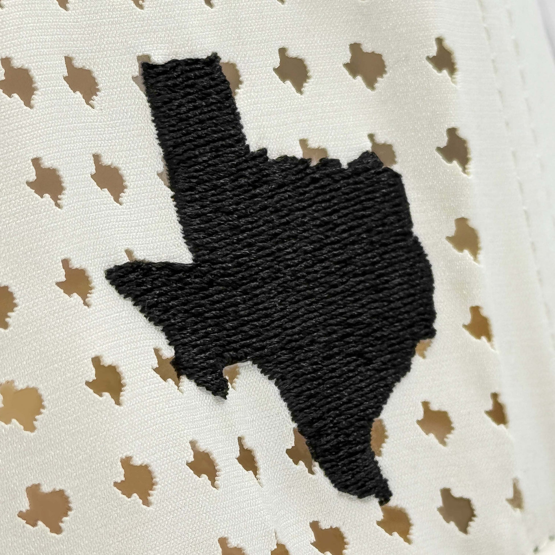 Texas Off White Performance Snapback Hat – Close-Up of Laser-Cut Texas Silhouettes